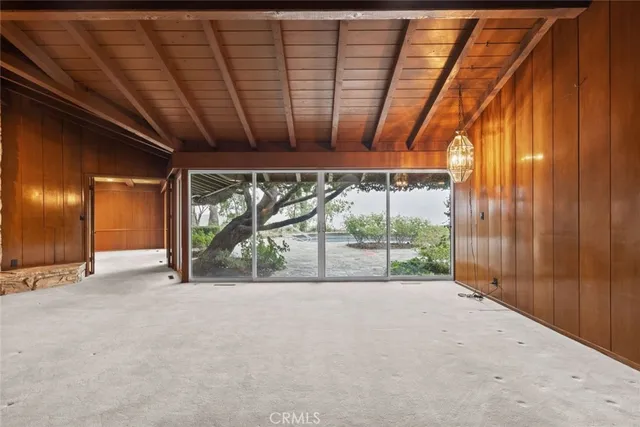 a view of an empty room with a balcony