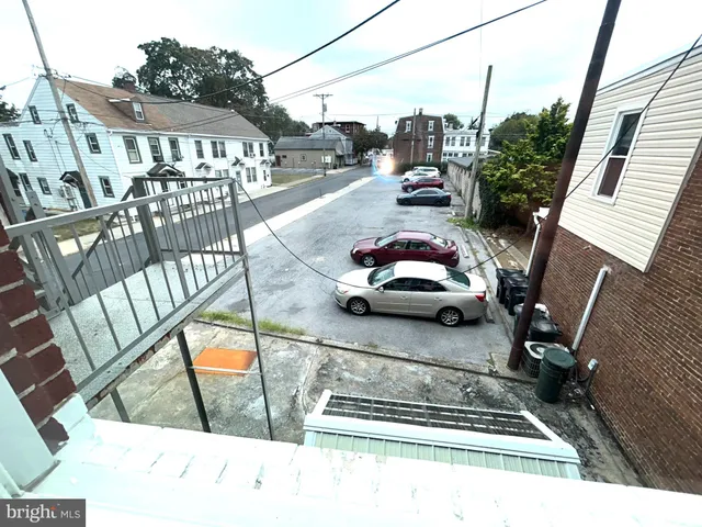 a view of a balcony with car parked