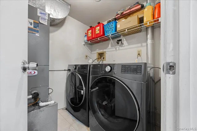 a bathroom with a toilet sink vanity and mirror