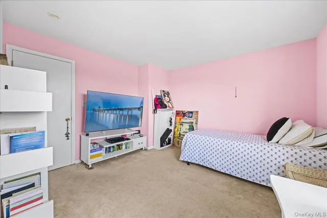 a bed room with a bed and a chair