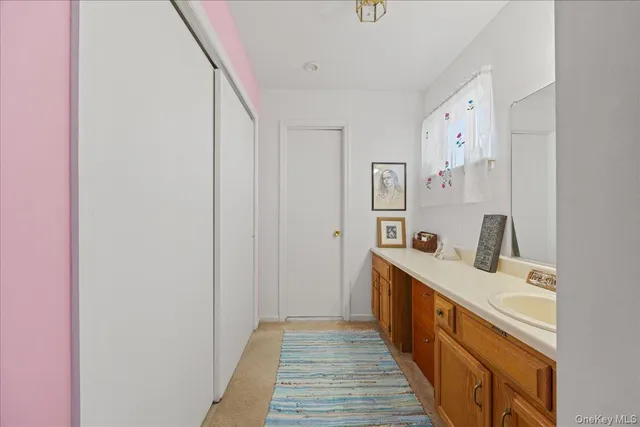 a bedroom with a bed table and chair