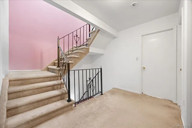 a white toilet sitting next to a bathroom sink