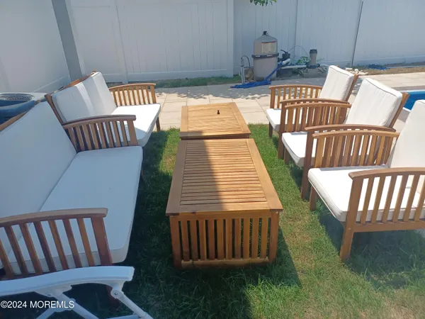 a balcony with table and chairs