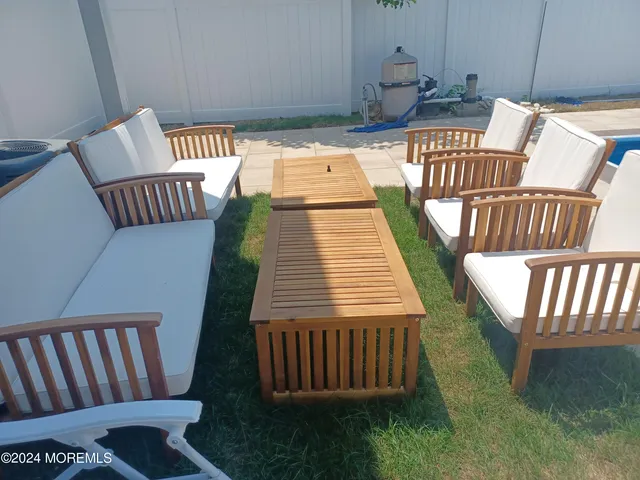 a balcony with table and chairs