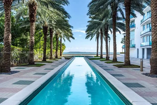 a view of swimming pool with sitting area