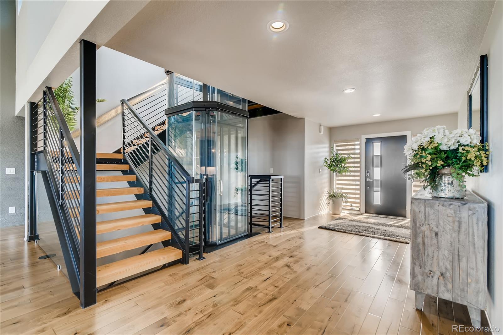 2147 Picture Point Drive Windsor, CO 80550 - Photo 20 of 39 a view of entryway with wooden floor and stairs