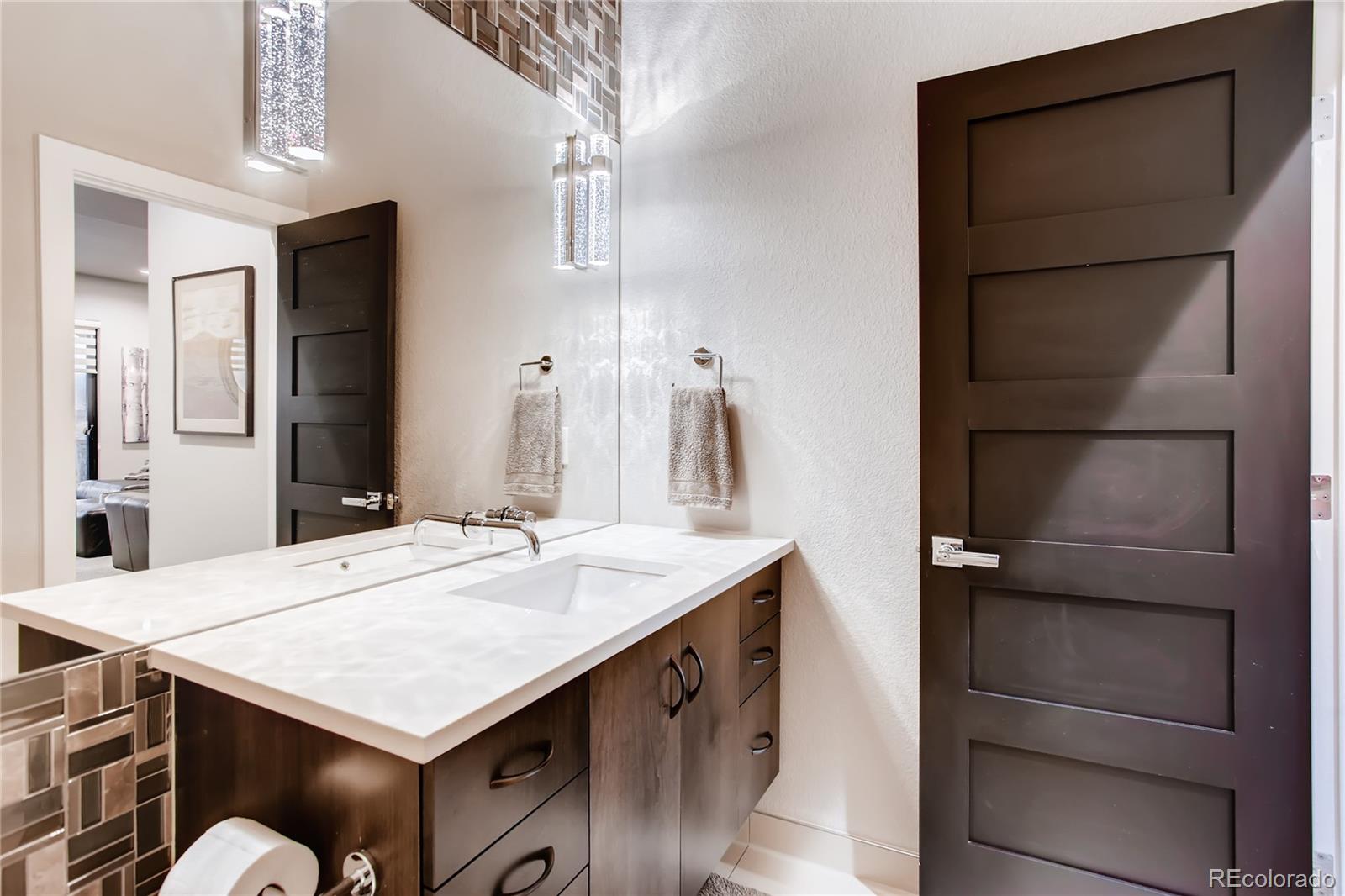 2147 Picture Point Drive Windsor, CO 80550 - Photo 29 of 39 a bathroom with a sink vanity and a mirror