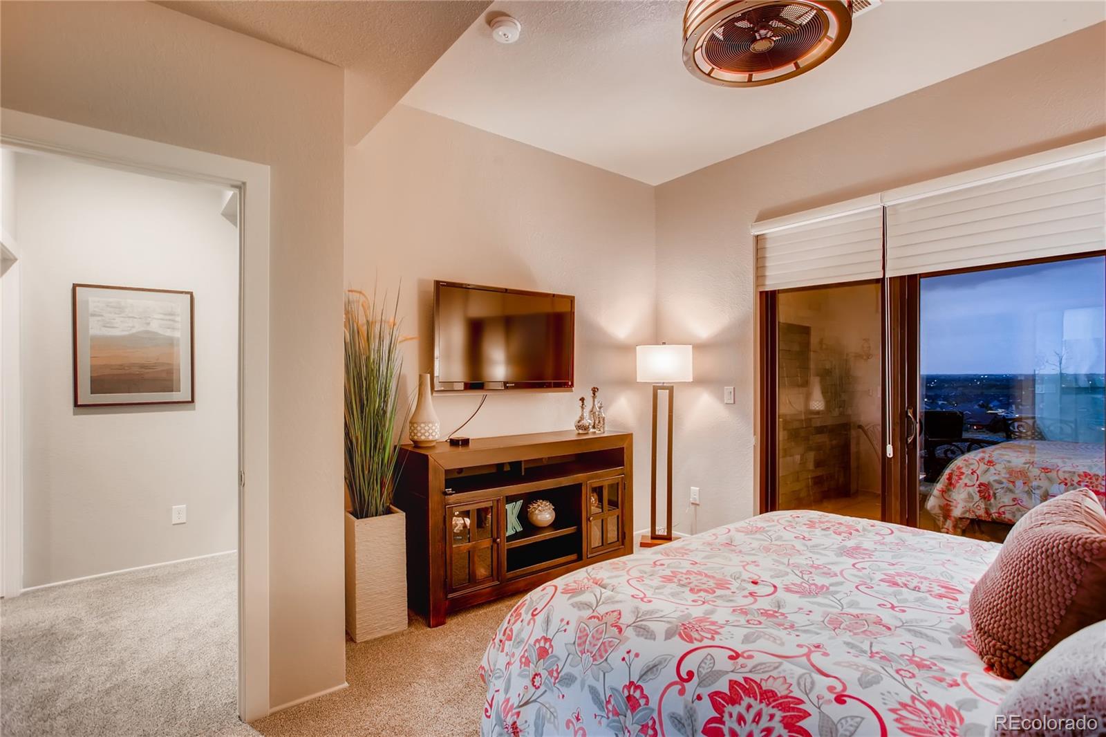 2147 Picture Point Drive Windsor, CO 80550 - Photo 31 of 39 a bedroom with a bed and a flat screen tv