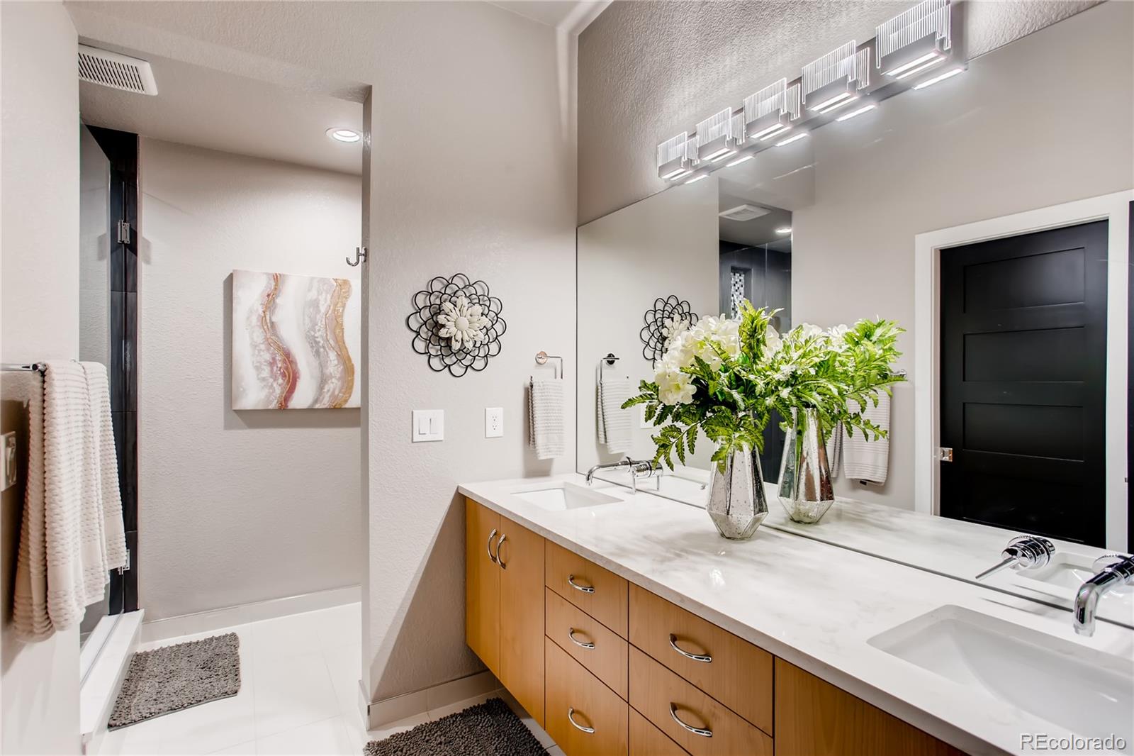 2147 Picture Point Drive Windsor, CO 80550 - Photo 32 of 39 a bathroom with a double vanity sink and a mirror