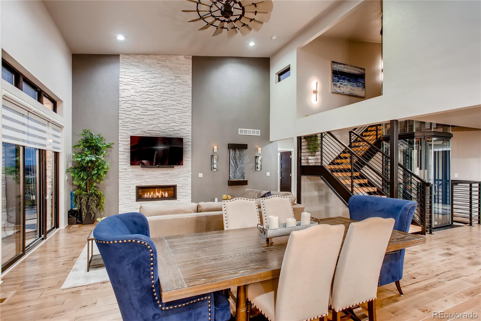 2147 Picture Point Drive Windsor, CO 80550 - Photo 4 of 39 a living room with furniture and a flat screen tv