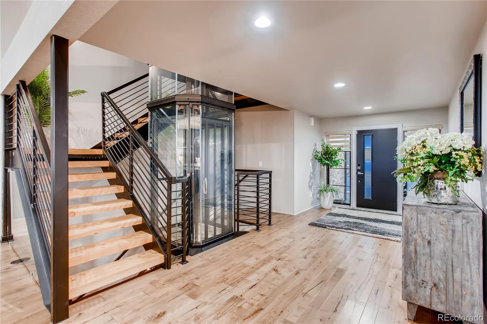 2147 Picture Point Drive Windsor, CO 80550 - Photo 5 of 39 a view of entryway with stairs and wooden floor