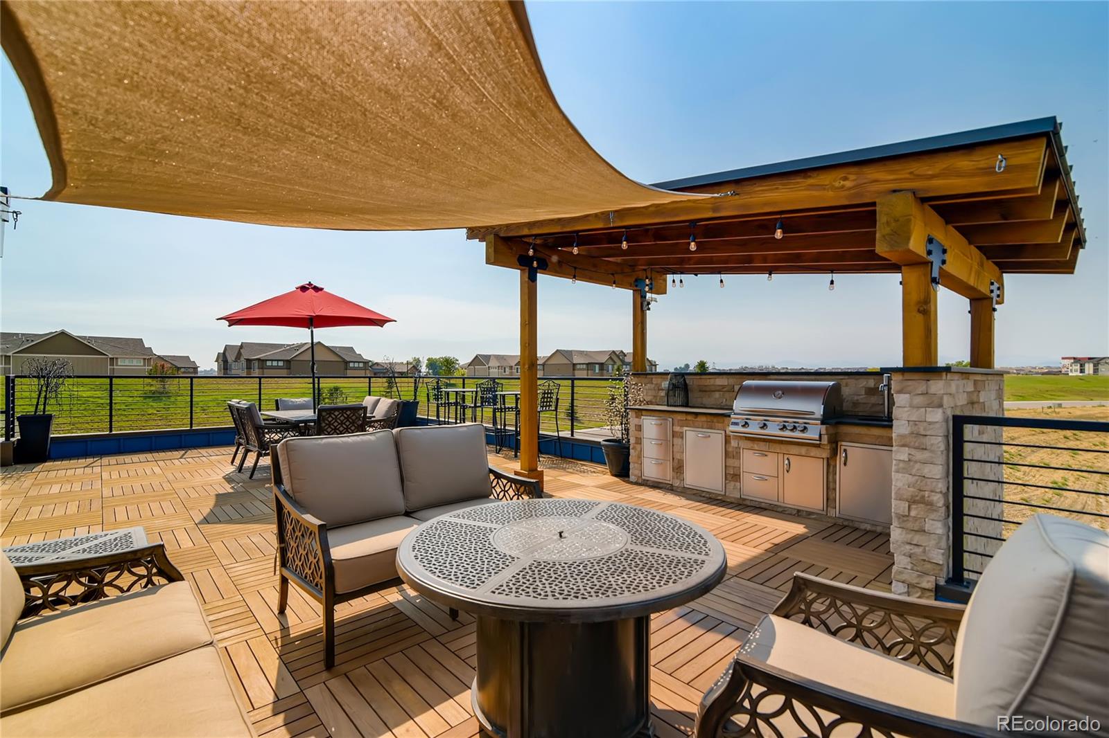 2147 Picture Point Drive Windsor, CO 80550 - Photo 6 of 39 a patio with a table and chairs