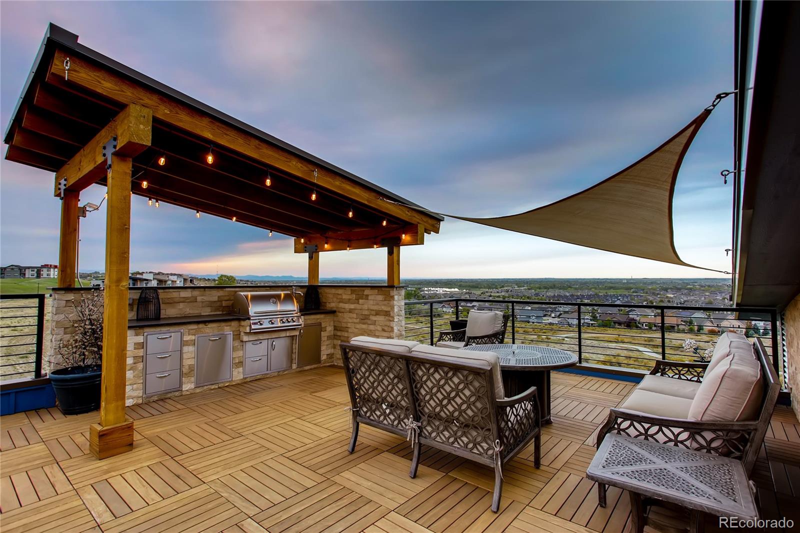 2147 Picture Point Drive Windsor, CO 80550 - Photo 7 of 39 a roof deck with a table and chairs