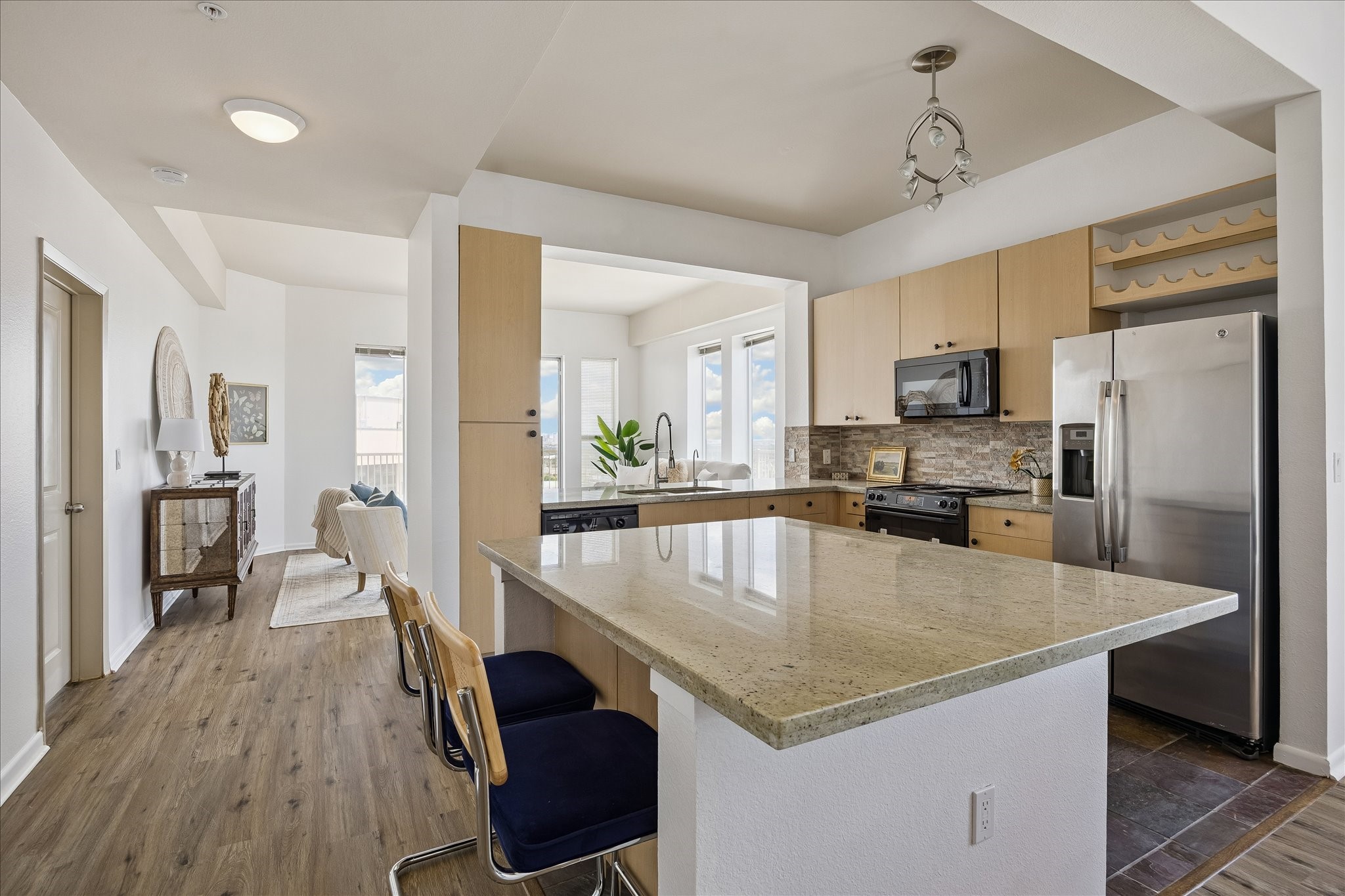 3505 Sage Road, Unit 2810 Houston, TX 77056 - Photo 4 of 26 a kitchen with a center island appliances and cabinets