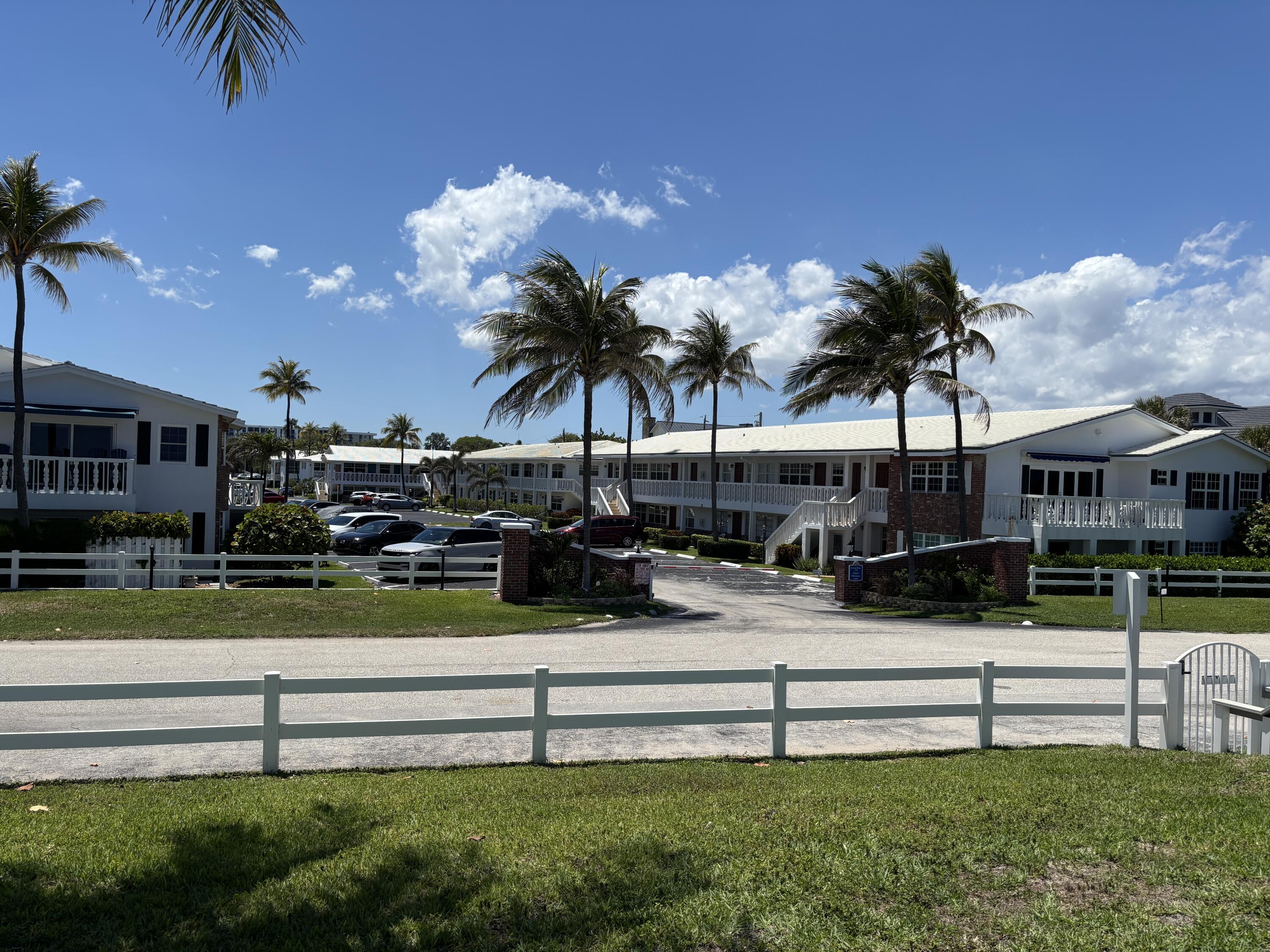 a view of swimming pool with outdoor seating and a garden