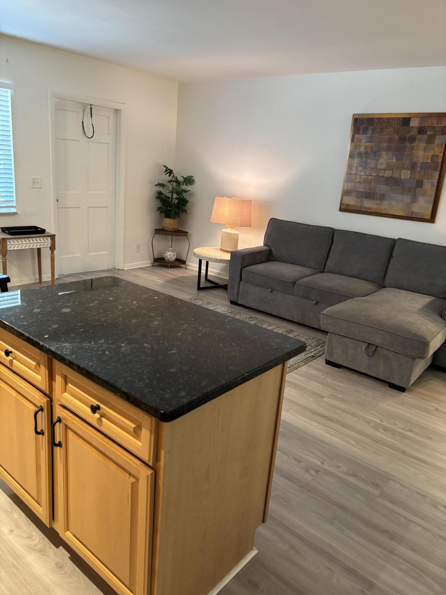 5505 North Ocean Boulevard, Unit 3204 Ocean Ridge, FL 33435 - Photo 12 of 33 a living room with furniture and wooden floor