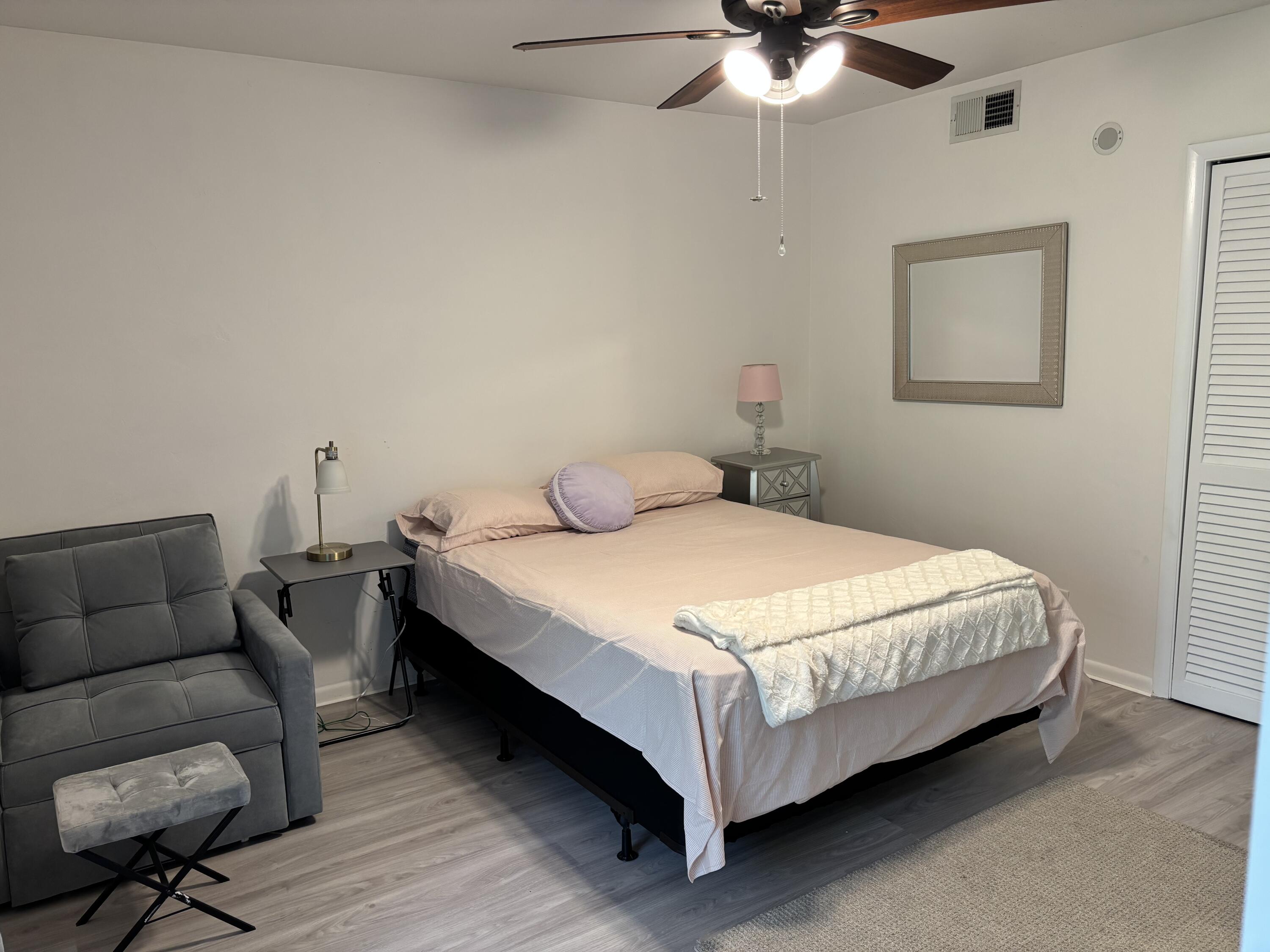 5505 North Ocean Boulevard, Unit 3204 Ocean Ridge, FL 33435 - Photo 15 of 33 a bedroom with bed and window