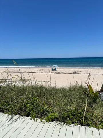a view of a swimming pool with seating space