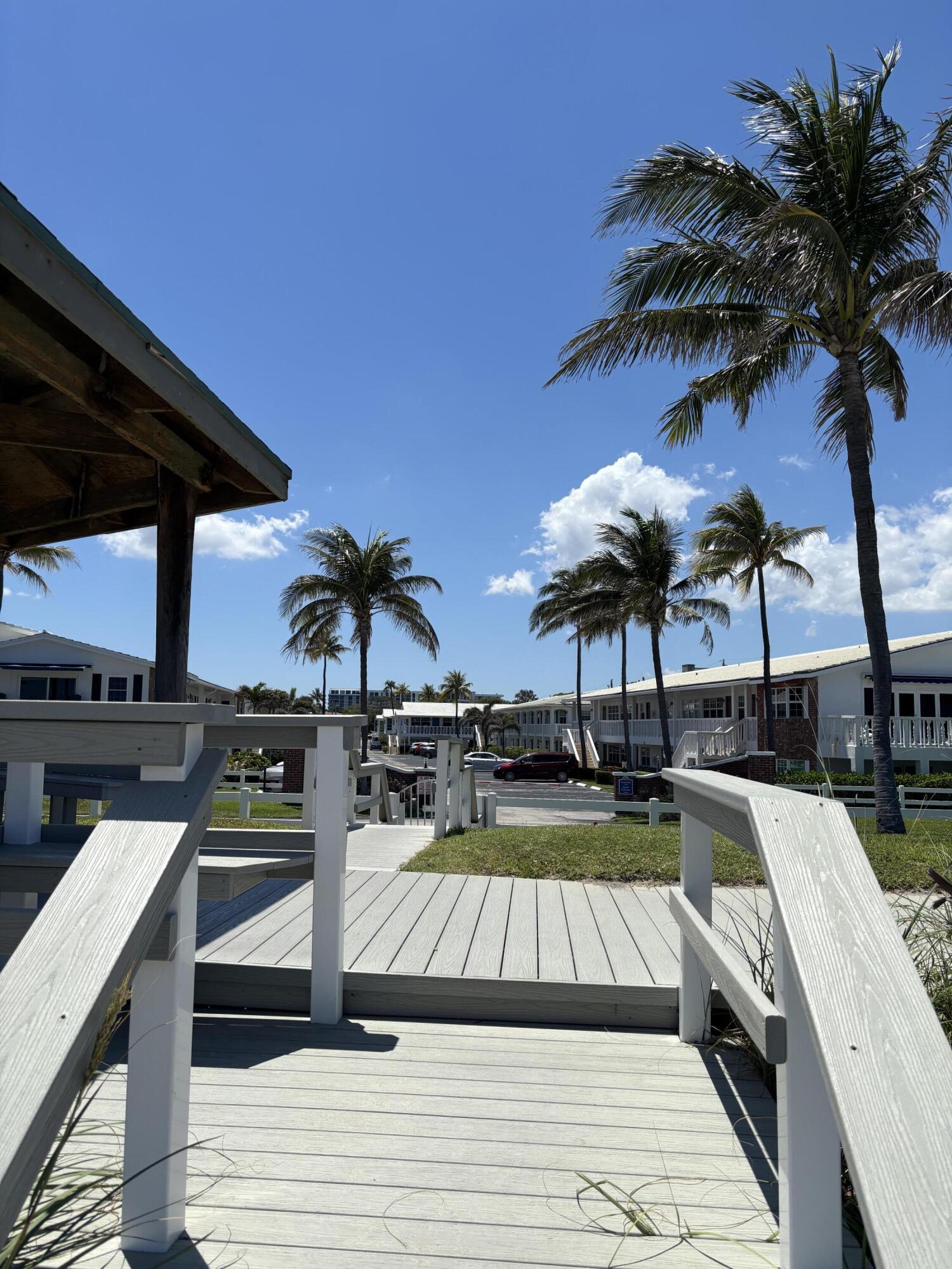 5505 North Ocean Boulevard, Unit 3204 Ocean Ridge, FL 33435 - Photo 23 of 33 a view of a swimming pool with seating space