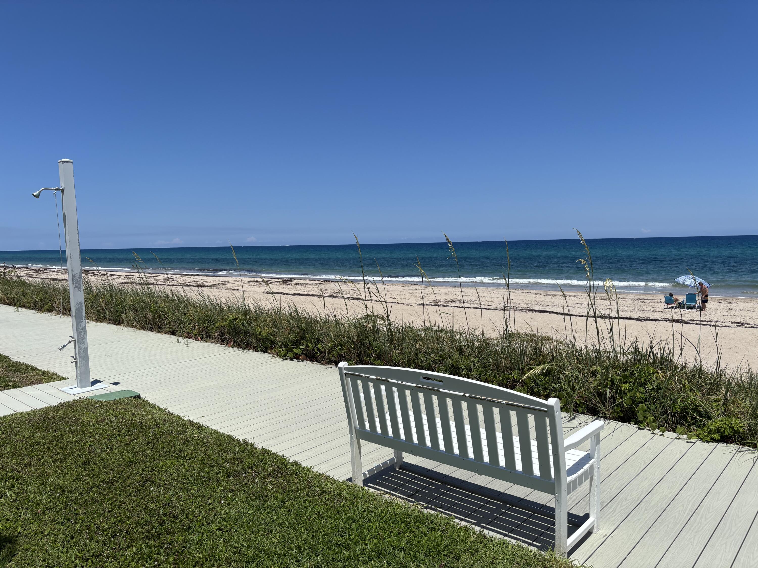 5505 North Ocean Boulevard, Unit 3204 Ocean Ridge, FL 33435 - Photo 25 of 33 a view of a deck with a yard