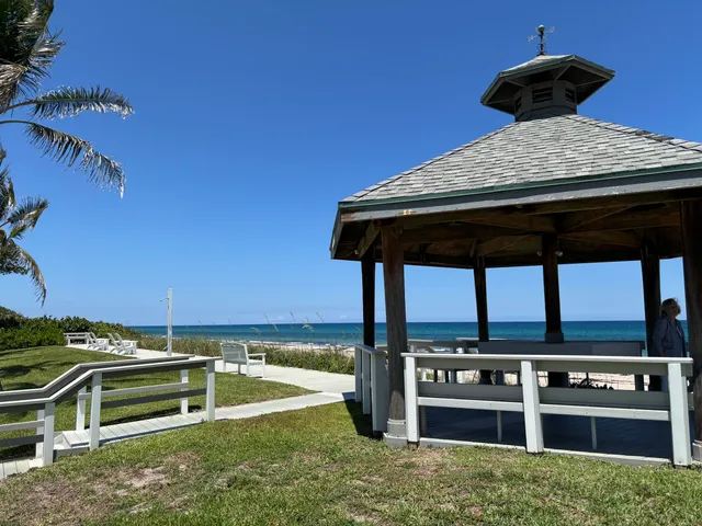 a view of a swimming pool with a table and chairs