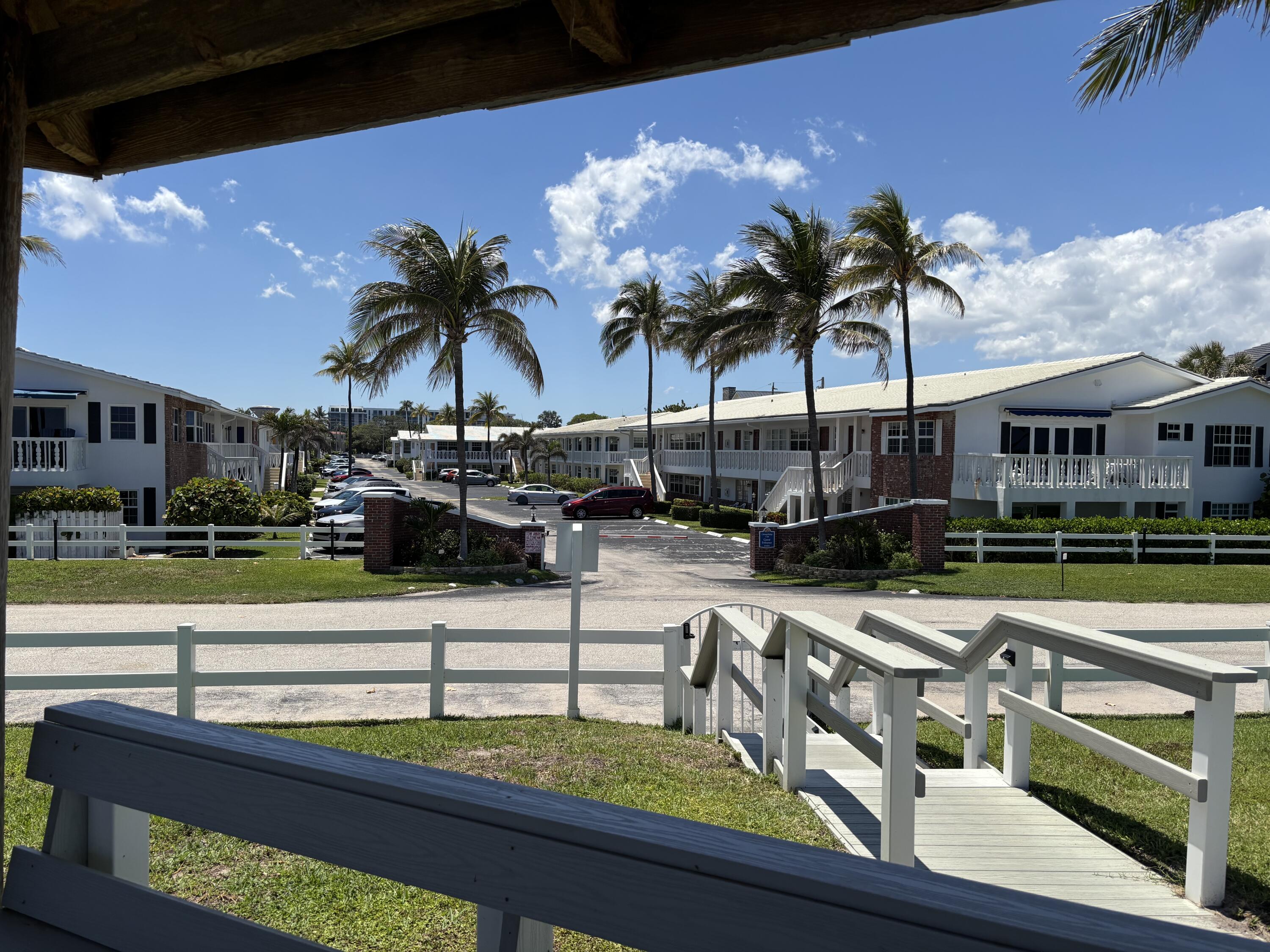 5505 North Ocean Boulevard, Unit 3204 Ocean Ridge, FL 33435 - Photo 27 of 33 a view of a swimming pool with a table and chairs