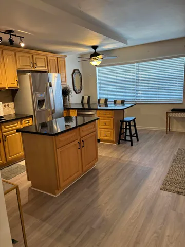a view of kitchen with wooden floor