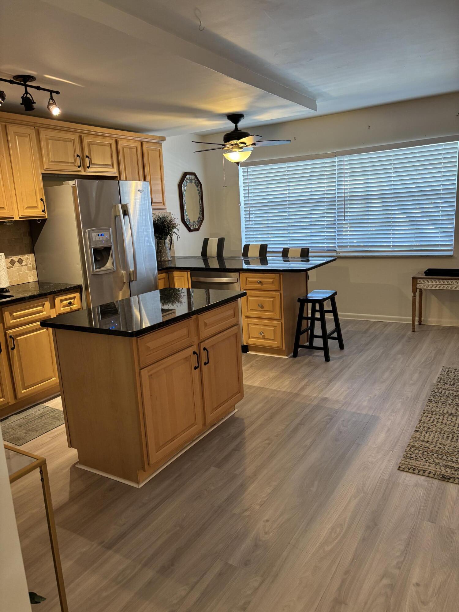 5505 North Ocean Boulevard, Unit 3204 Ocean Ridge, FL 33435 - Photo 6 of 33 a view of kitchen with wooden floor