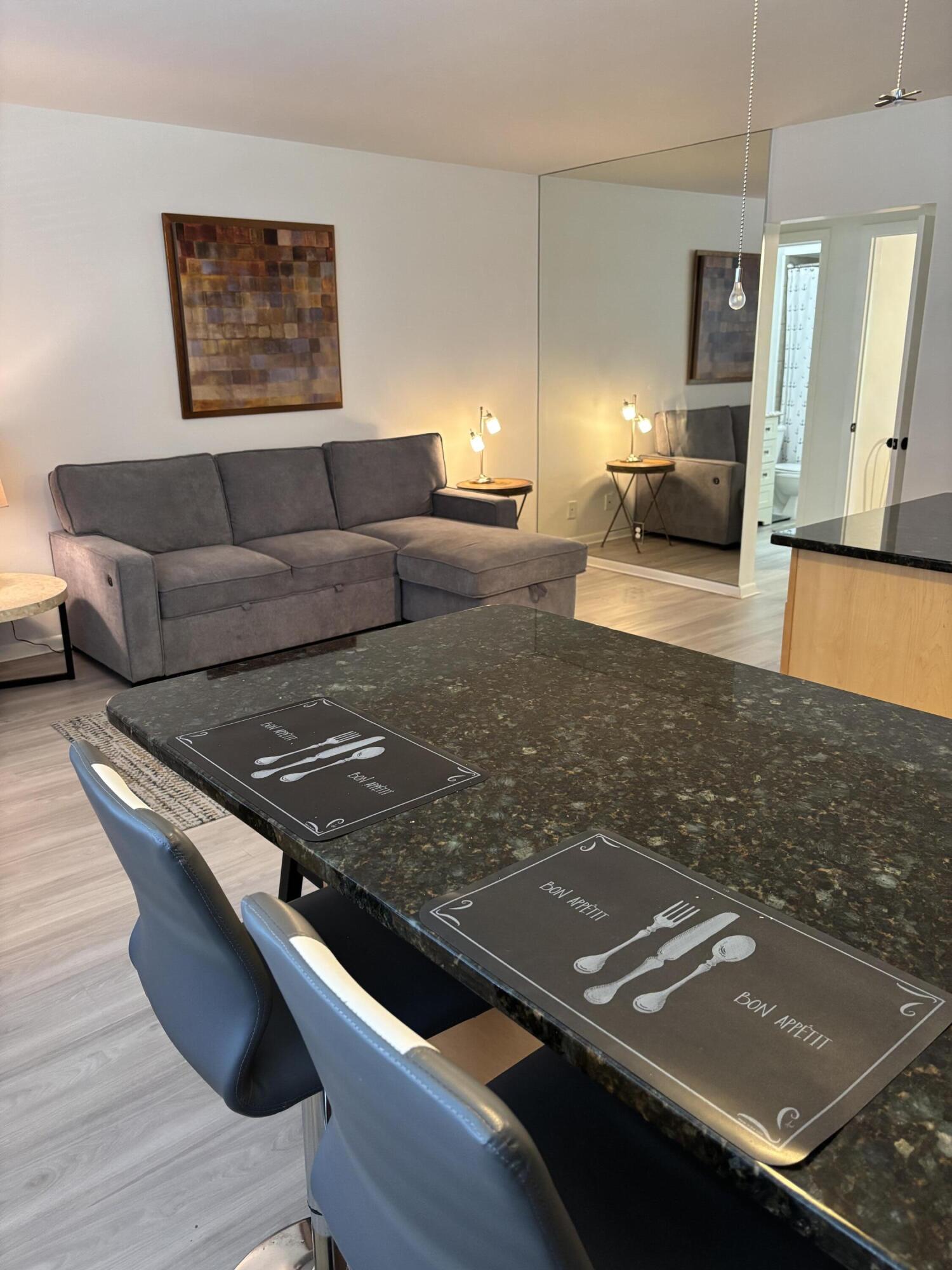 5505 North Ocean Boulevard, Unit 3204 Ocean Ridge, FL 33435 - Photo 7 of 33 a view of a living room and dining room