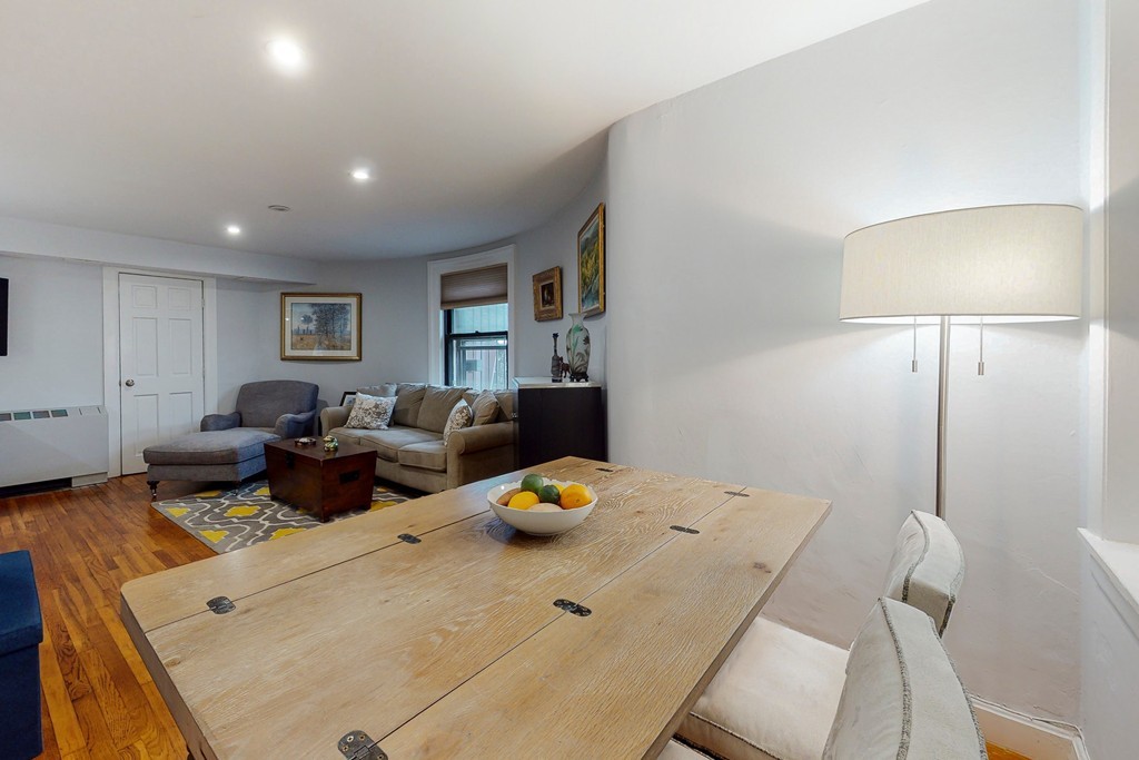 242 Beacon Street, Unit 2 Boston, MA 02116 - Photo 4 of 10 a living room with furniture and a table