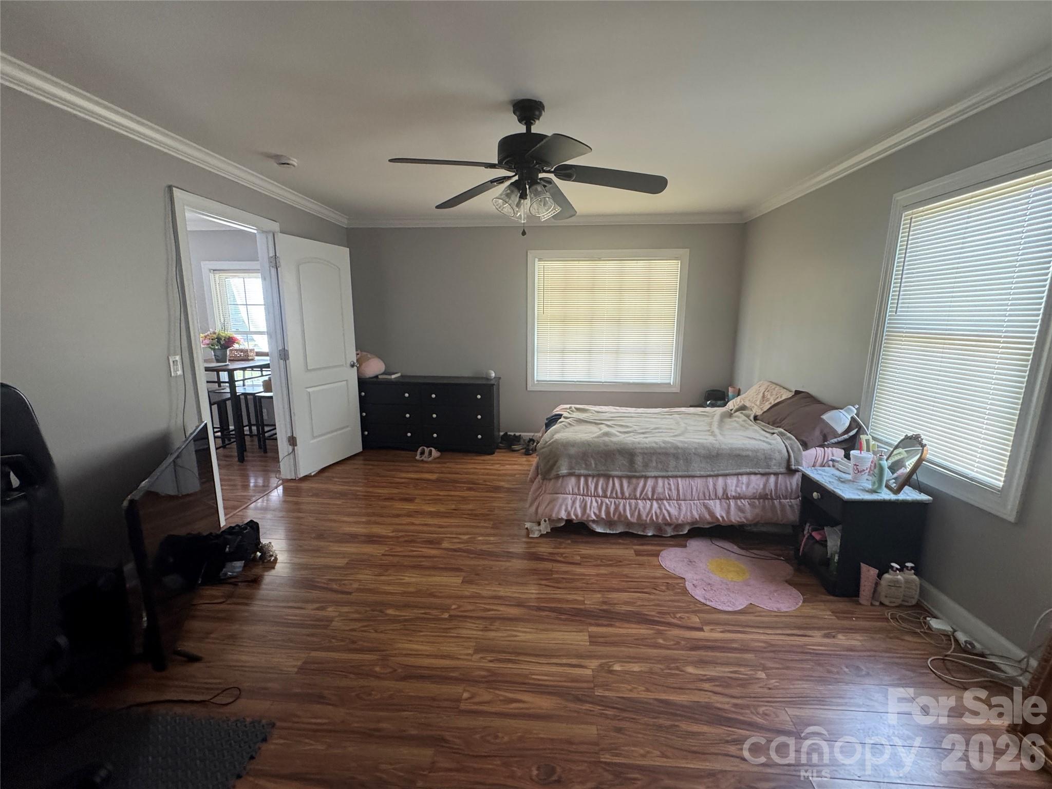 1405 Hickory Grove Road Gastonia, NC 28056 - Photo 12 of 15 a bedroom with a bed and wooden floor