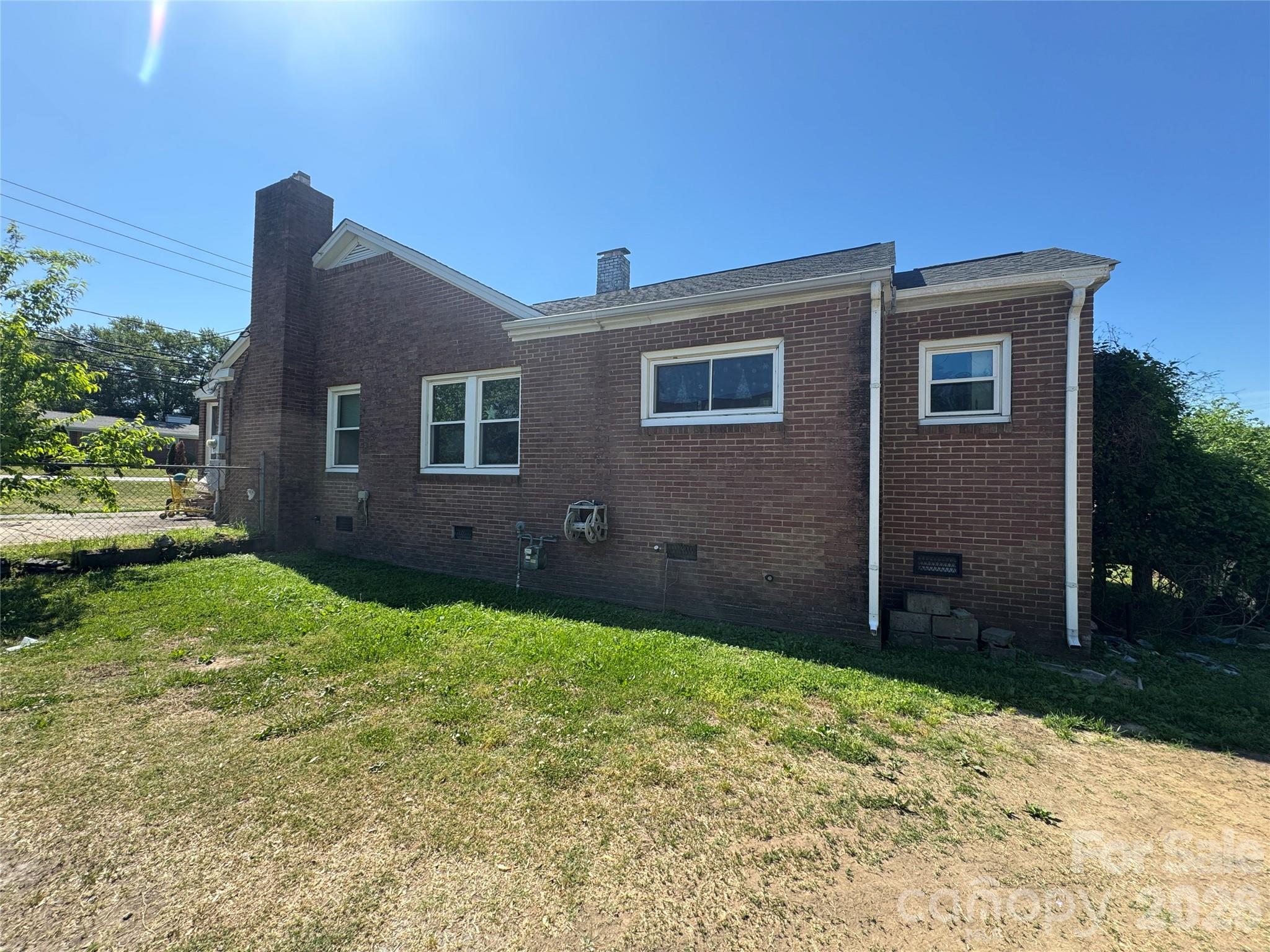 1405 Hickory Grove Road Gastonia, NC 28056 - Photo 2 of 15 a backyard of a house with lots of green space