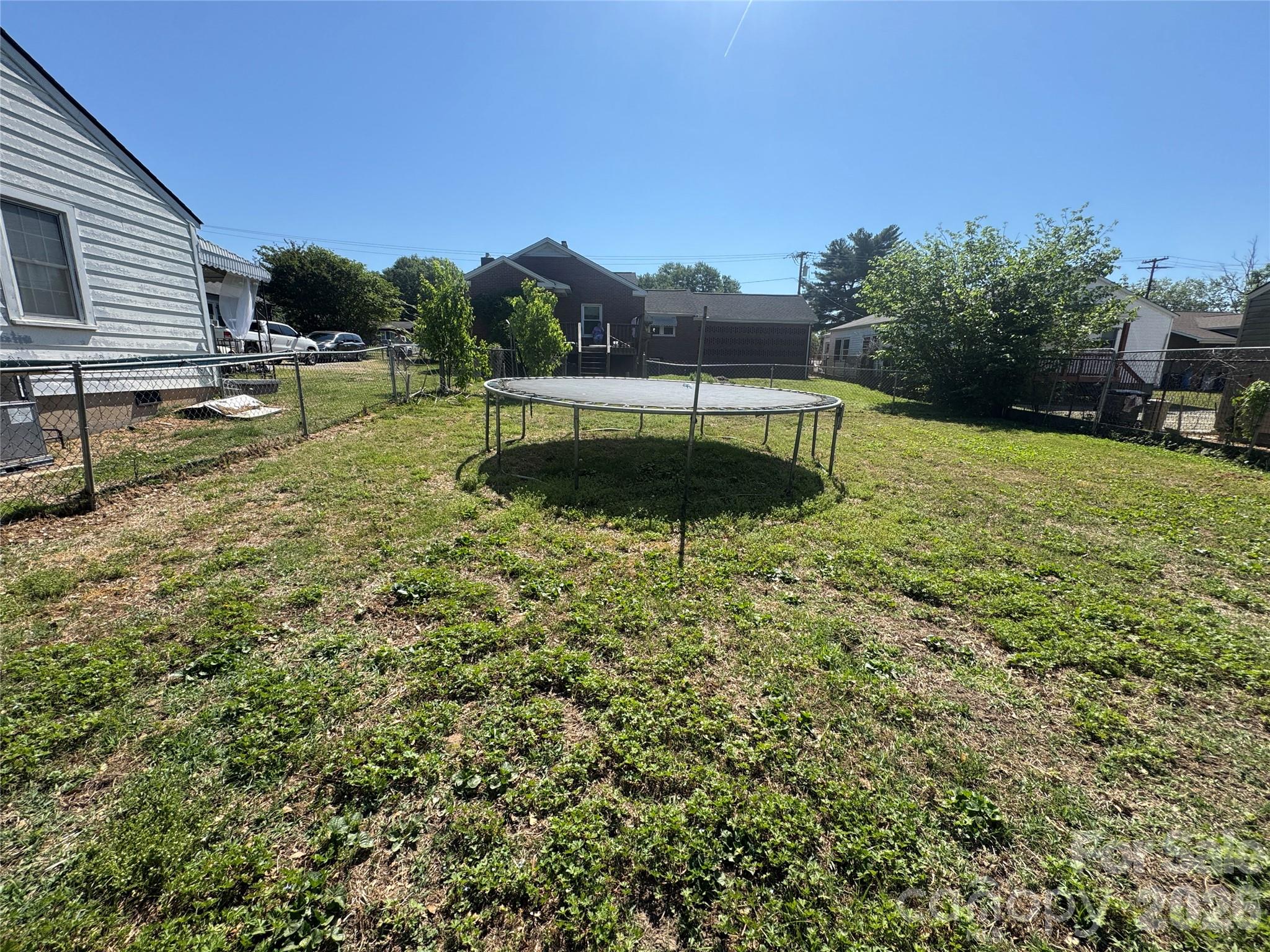 1405 Hickory Grove Road Gastonia, NC 28056 - Photo 3 of 15 a backyard of a house with lots of green space