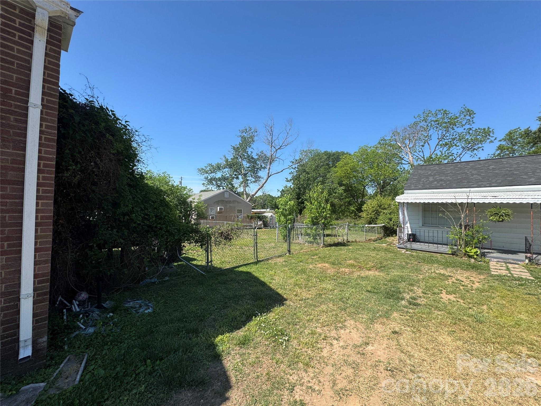 1405 Hickory Grove Road Gastonia, NC 28056 - Photo 5 of 15 a view of a backyard with a garden and plants