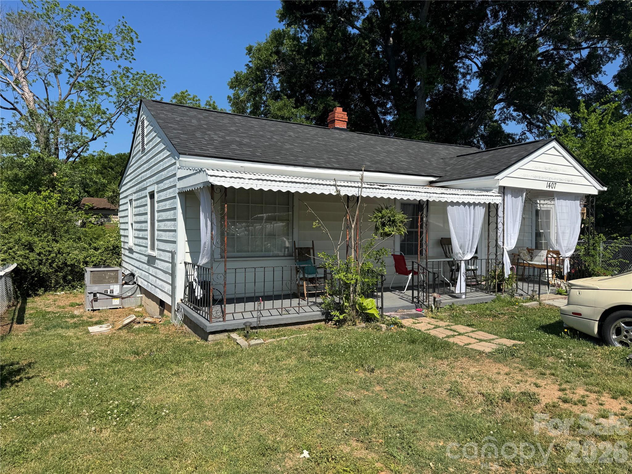 1405 Hickory Grove Road Gastonia, NC 28056 - Photo 6 of 15 a view of a house with patio