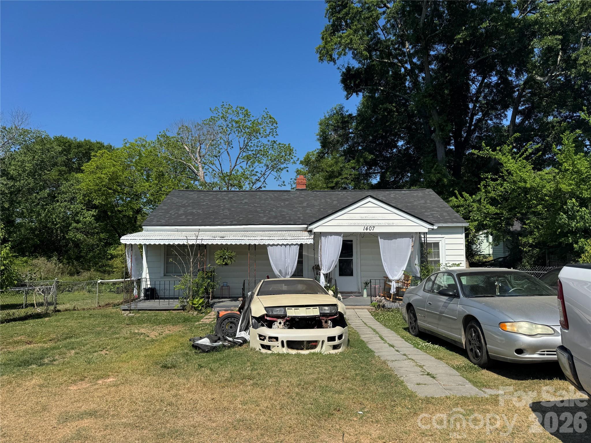 1405 Hickory Grove Road Gastonia, NC 28056 - Photo 7 of 15 a front view of a house with cars parked