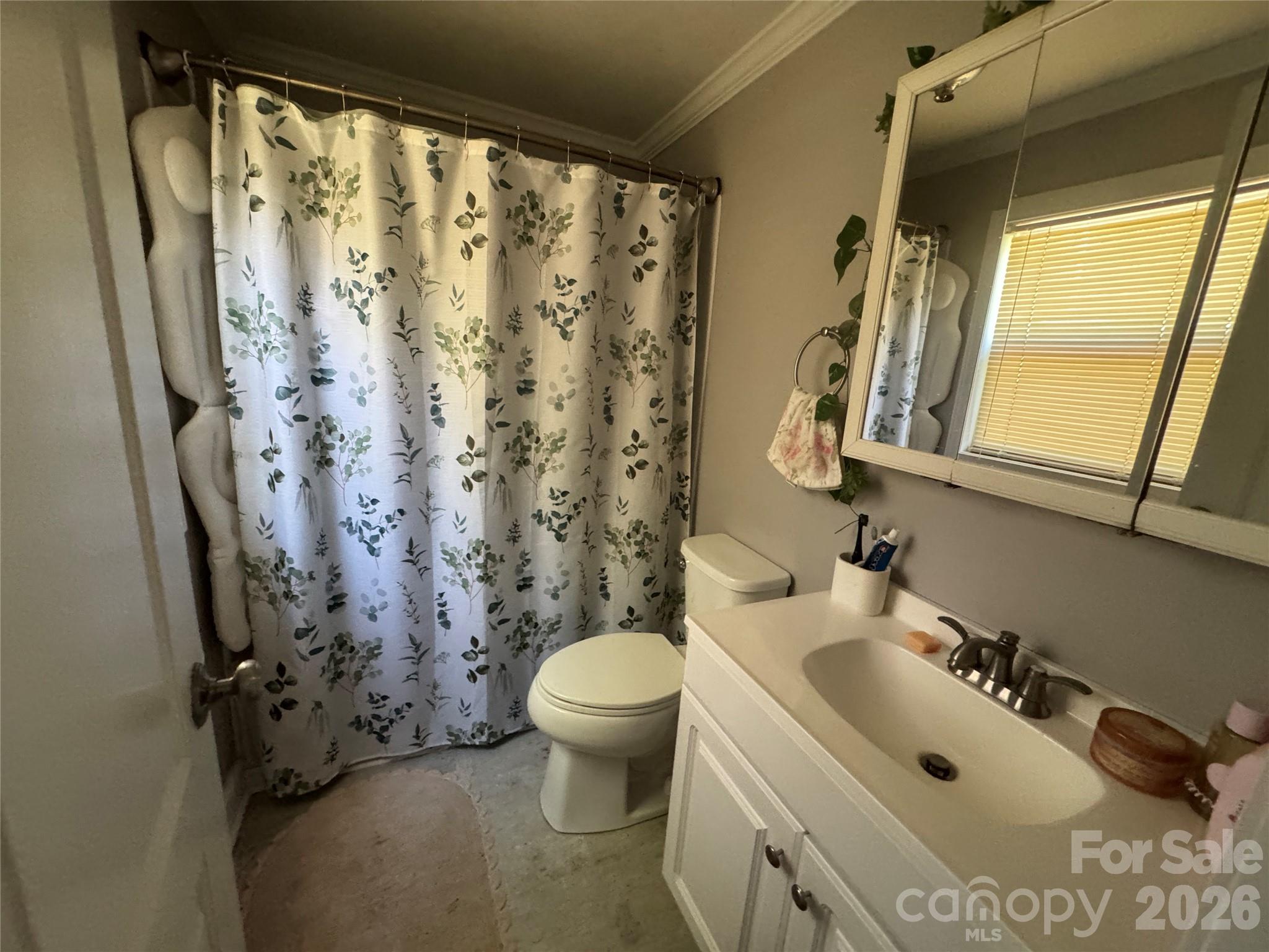 1405 Hickory Grove Road Gastonia, NC 28056 - Photo 10 of 15 a bathroom with a sink toilet and shower