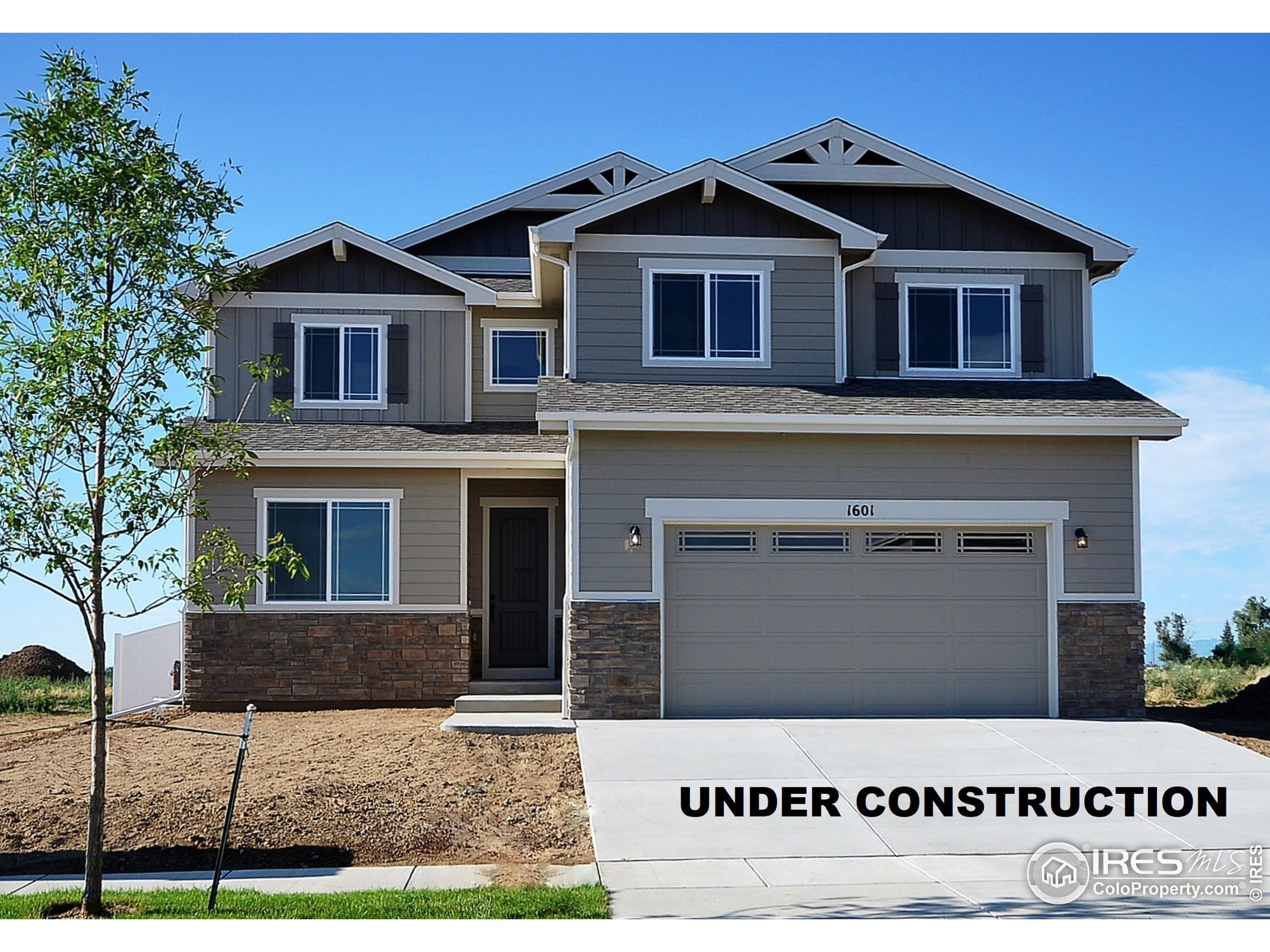 6630 Pebble Path Court Timnath, CO 80547 - Photo 1 of 18 a view of a front of a house with a yard
