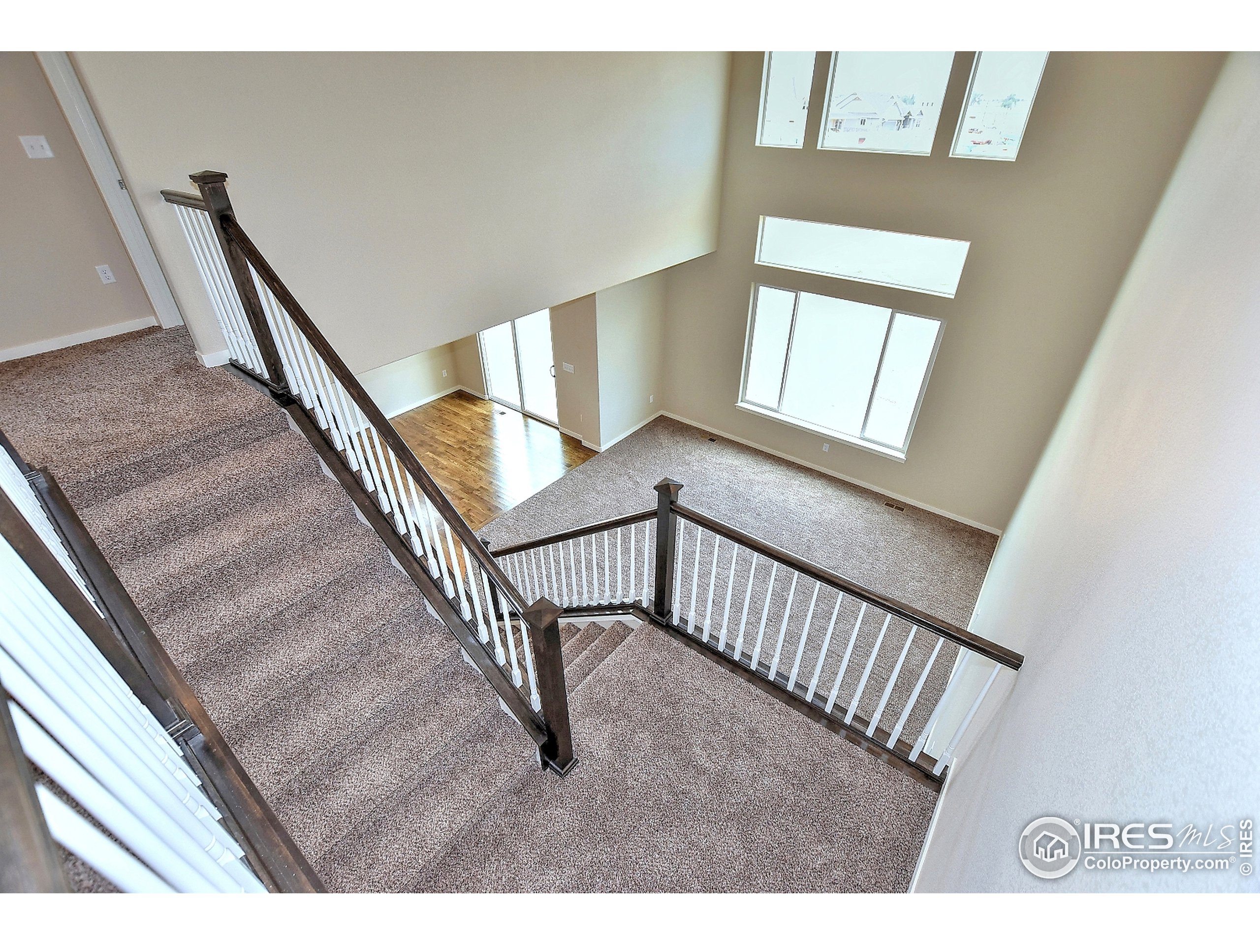 6630 Pebble Path Court Timnath, CO 80547 - Photo 15 of 18 a view of a hallway with stairs