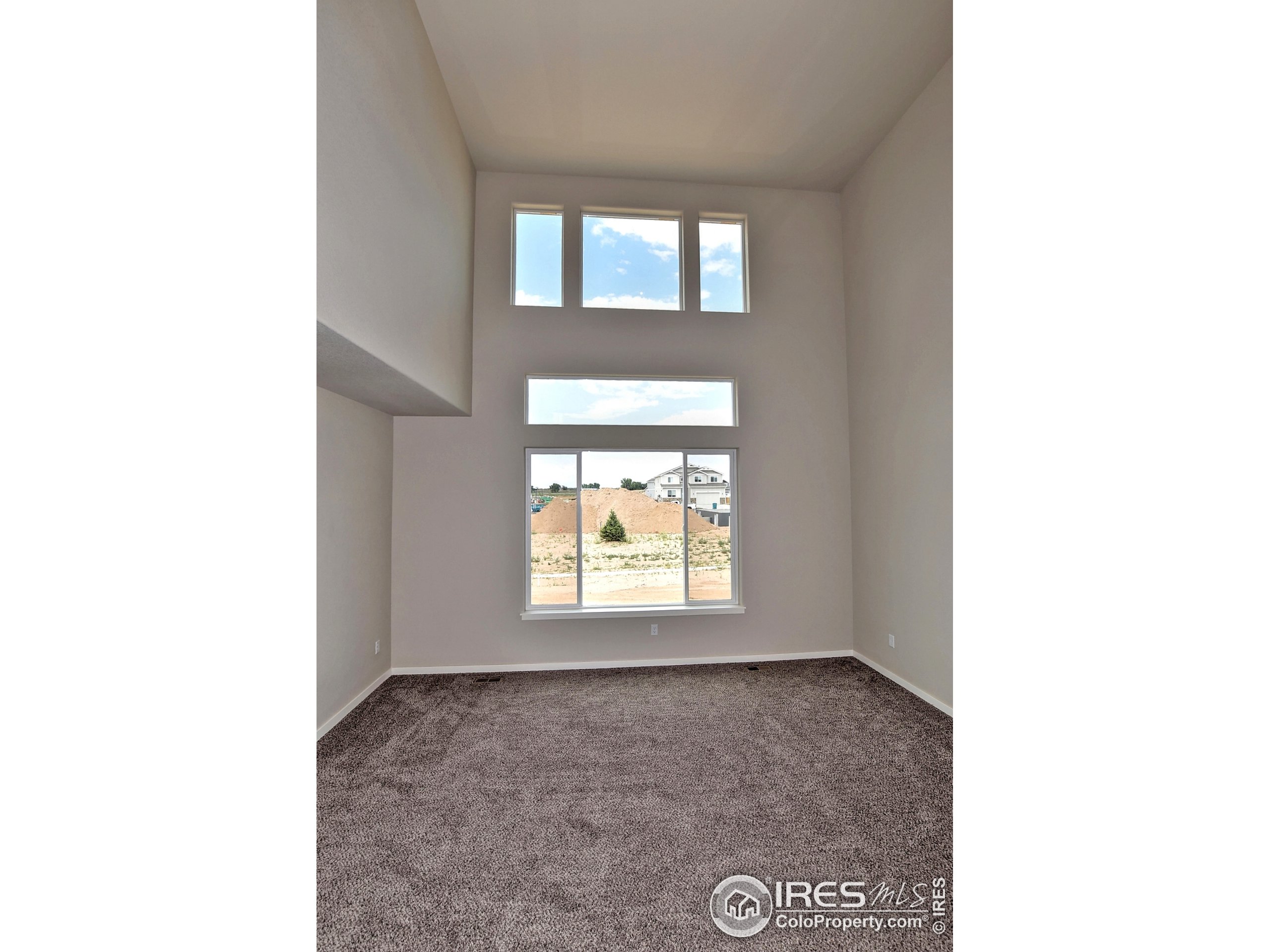 6630 Pebble Path Court Timnath, CO 80547 - Photo 3 of 18 a view of a room that has a window in it