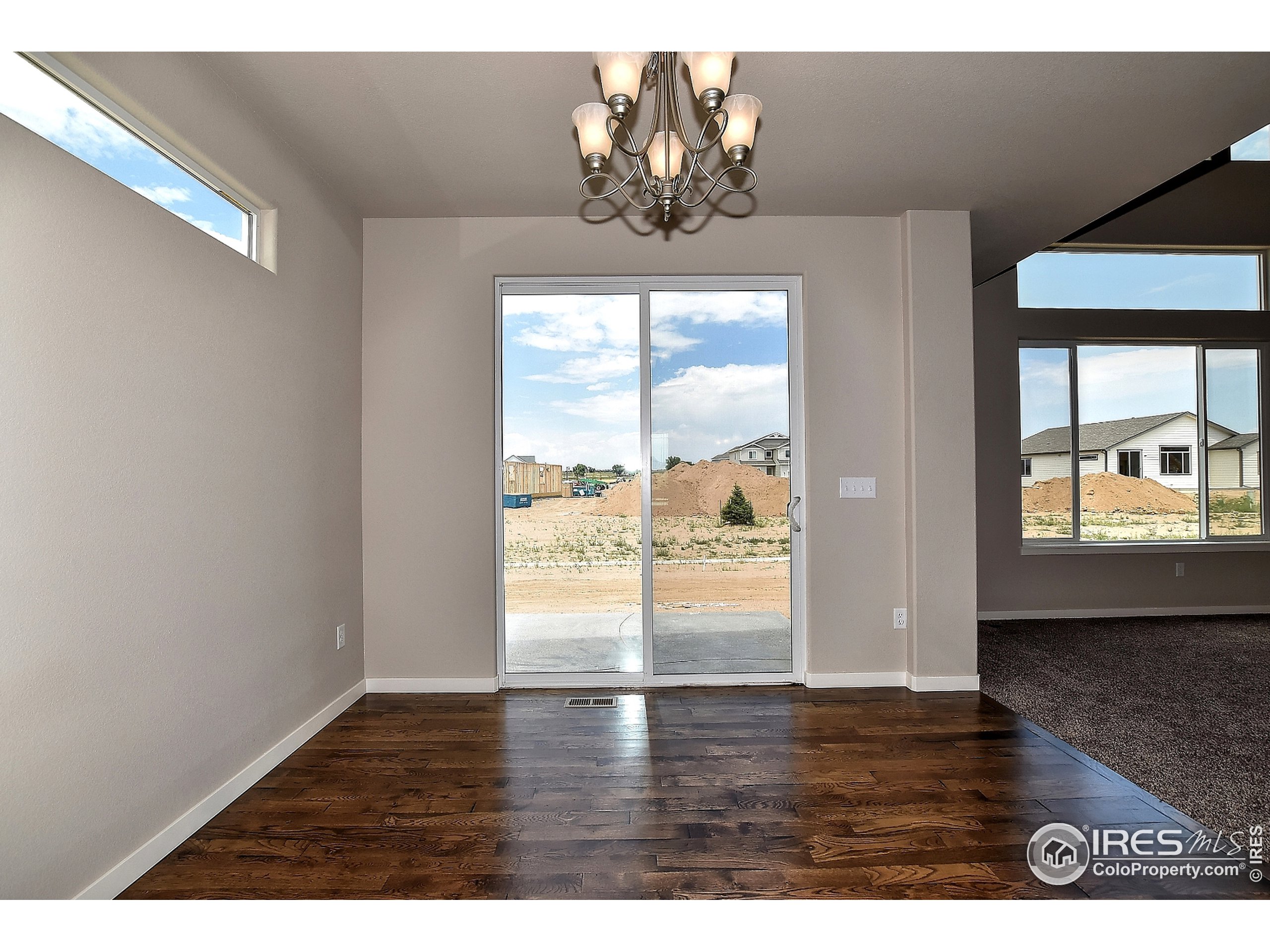 6630 Pebble Path Court Timnath, CO 80547 - Photo 9 of 18 a view of an empty room and window