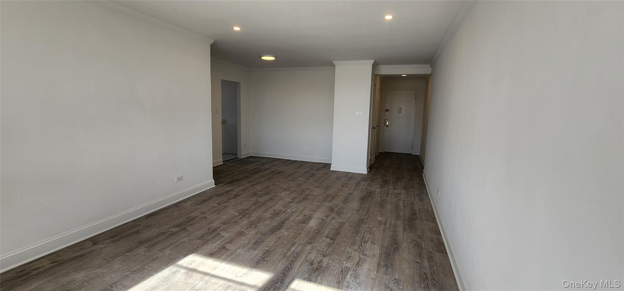 222-89 Braddock Avenue, Unit 5A Queens, NY 11428 - Photo 5 of 9 a view of hallway with wooden floor