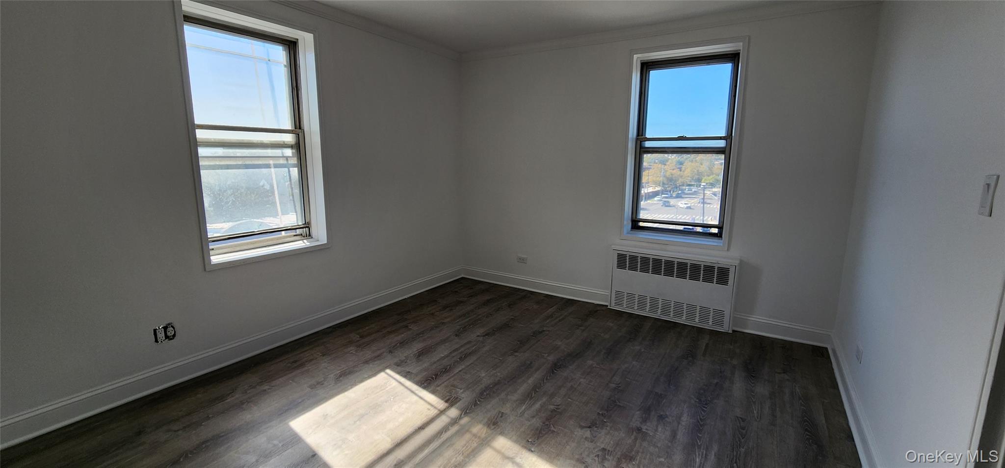 222-89 Braddock Avenue, Unit 5A Queens, NY 11428 - Photo 8 of 9 a view of an empty room and window