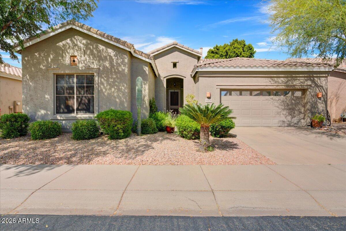 4906 East Wagoner Road Scottsdale, AZ 85254 - Photo 1 of 29 a front view of a house with garden