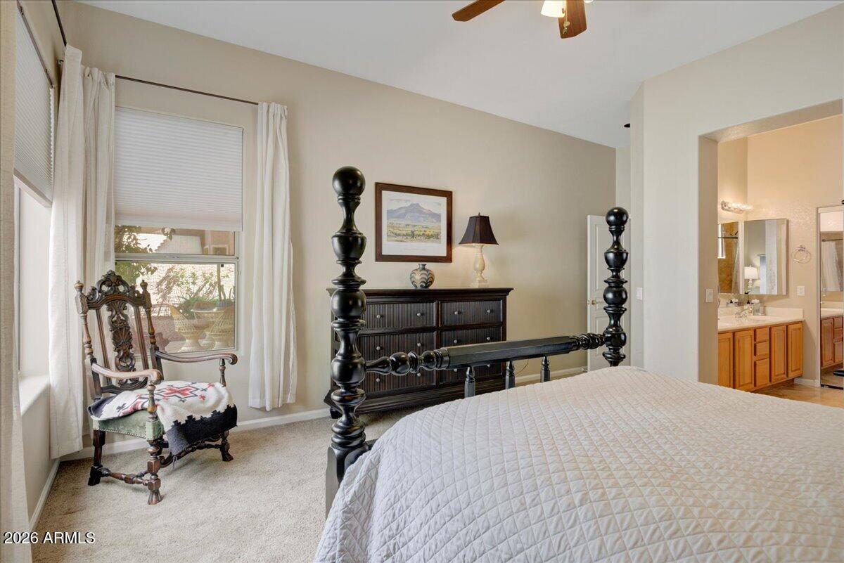 4906 East Wagoner Road Scottsdale, AZ 85254 - Photo 11 of 29 a bedroom with a bed and wooden floor