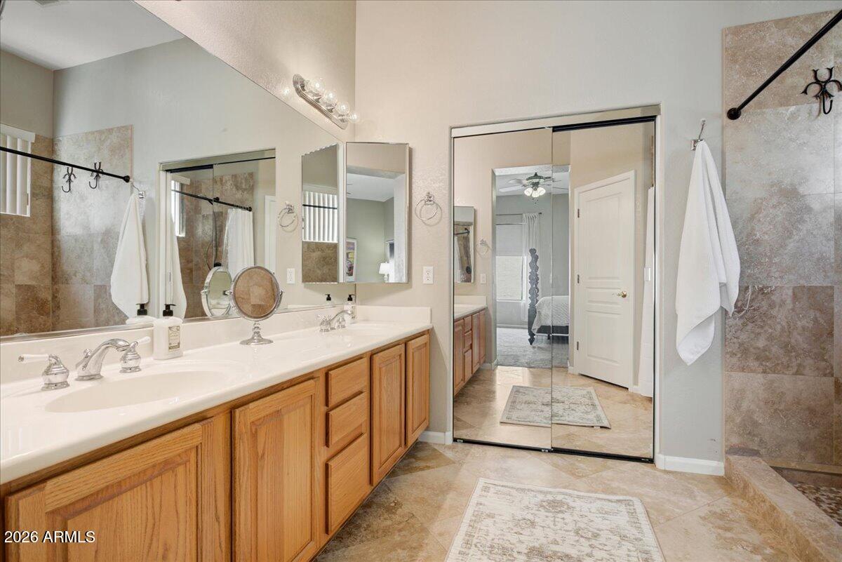 4906 East Wagoner Road Scottsdale, AZ 85254 - Photo 12 of 29 a bathroom with a granite countertop sink mirror and shower