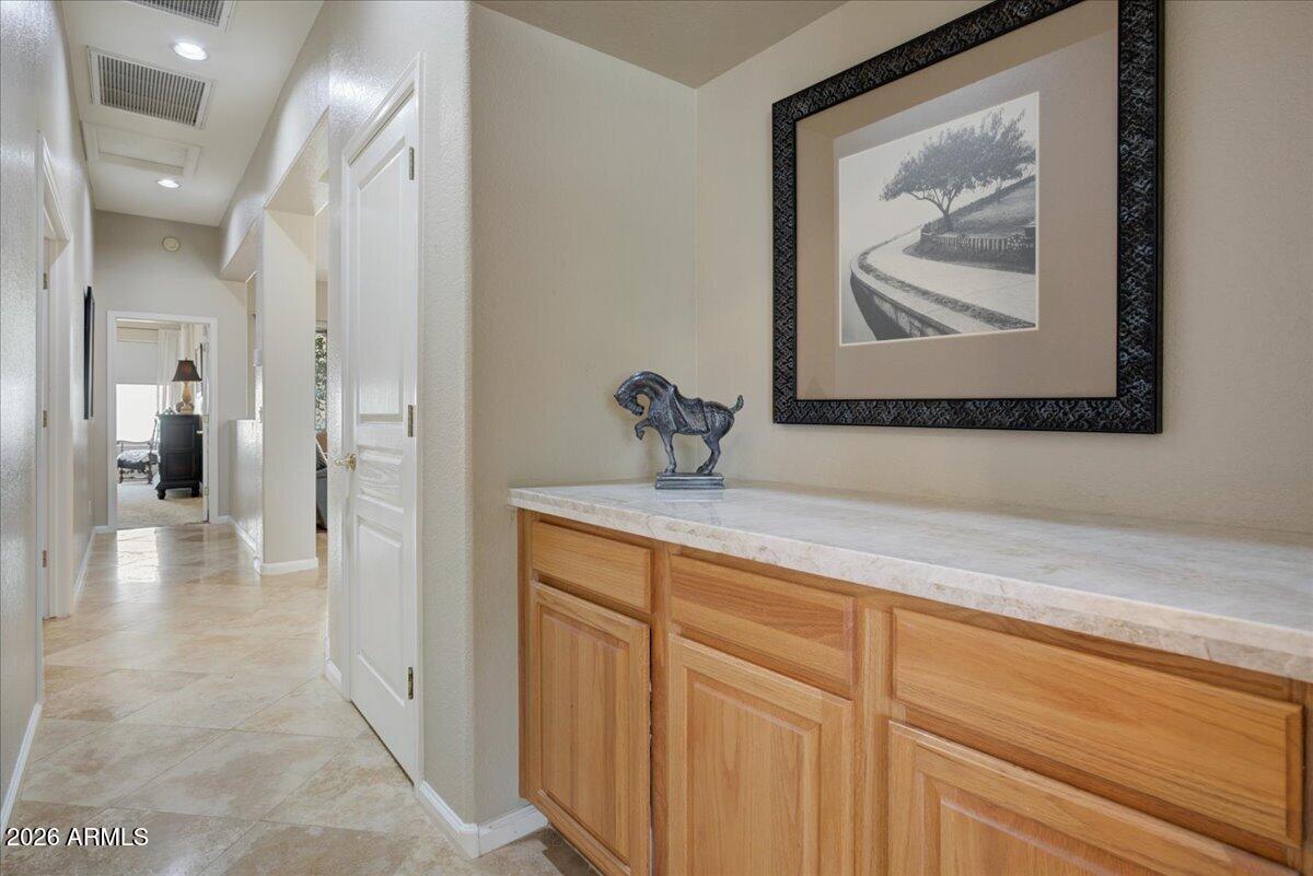 4906 East Wagoner Road Scottsdale, AZ 85254 - Photo 14 of 29 a view of a hallway view with wooden floor and cabinet