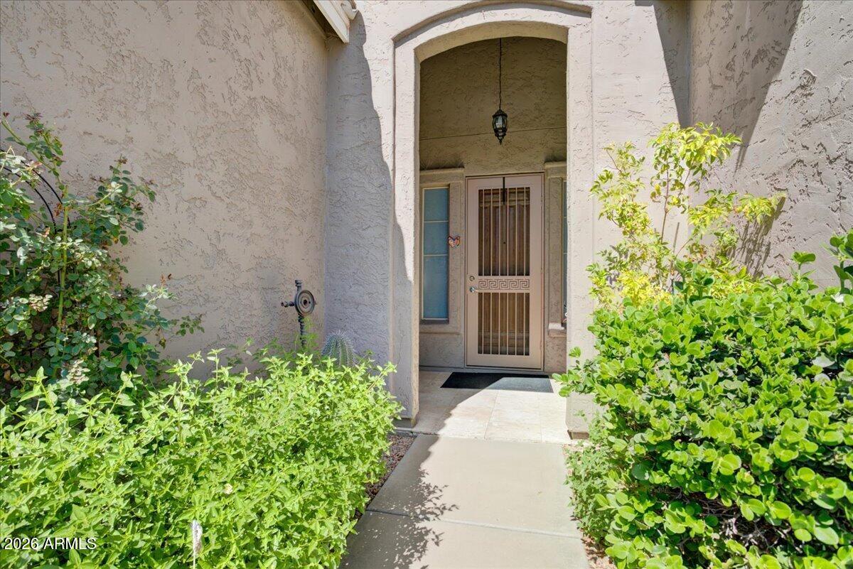 4906 East Wagoner Road Scottsdale, AZ 85254 - Photo 2 of 29 a front view of a house with a yard