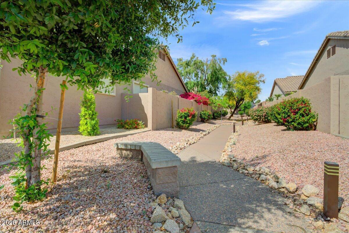 4906 East Wagoner Road Scottsdale, AZ 85254 - Photo 29 of 29 a front view of a house with a yard and a garage
