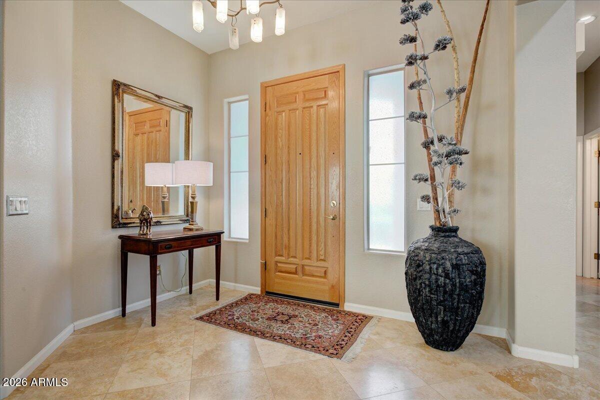 4906 East Wagoner Road Scottsdale, AZ 85254 - Photo 3 of 29 a room with a table and a potted plant